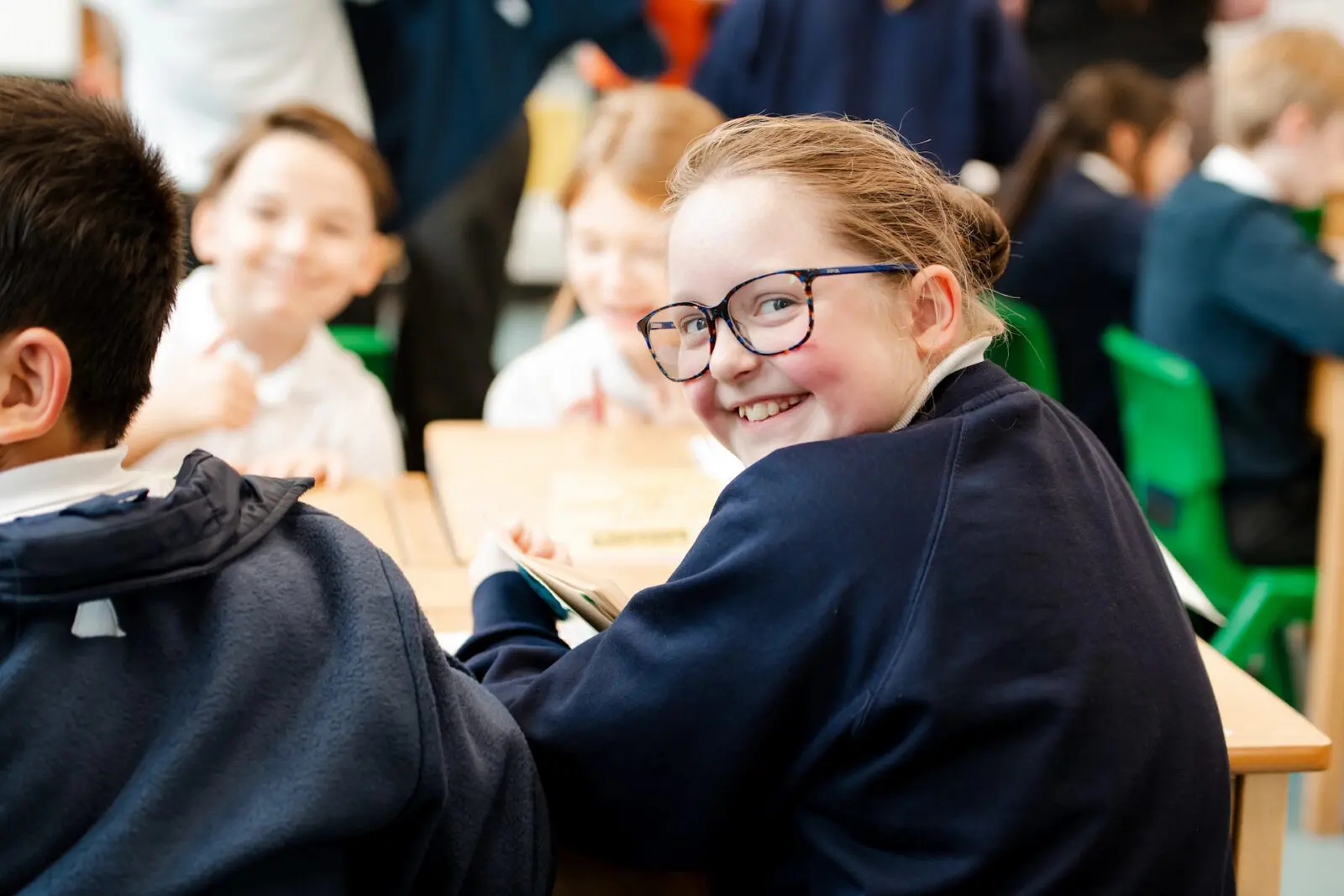 Smiling student reading a book