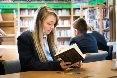 Student reading in library